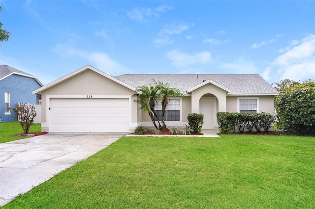 ranch-style home featuring a garage and a front yard