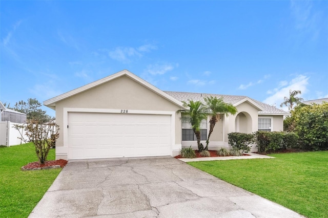 ranch-style home with a garage and a front lawn