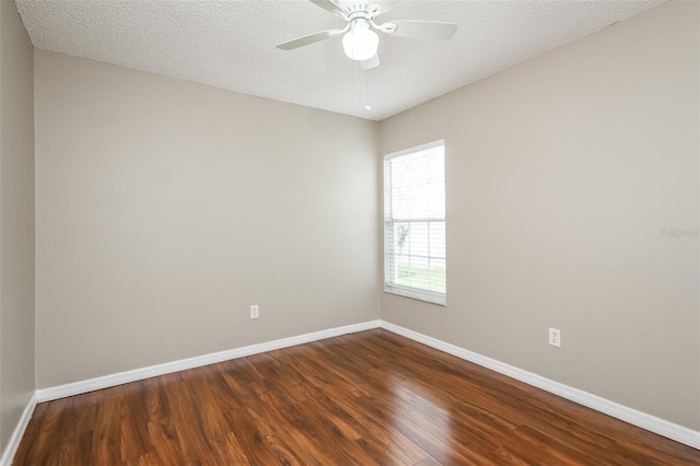 spare room with hardwood / wood-style floors, a textured ceiling, and ceiling fan