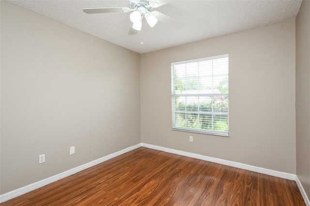 empty room with hardwood / wood-style floors, a textured ceiling, and ceiling fan