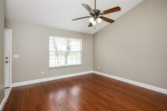 spare room with a textured ceiling, ceiling fan, wood-type flooring, and vaulted ceiling