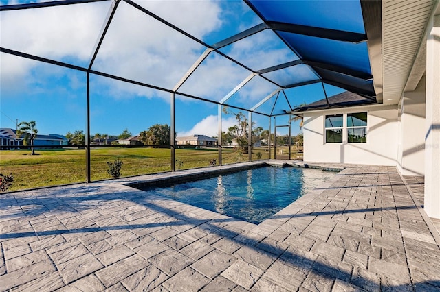 view of swimming pool with a patio area, a lawn, and glass enclosure