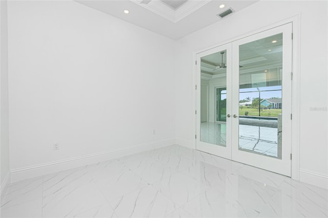 empty room with ornamental molding and french doors