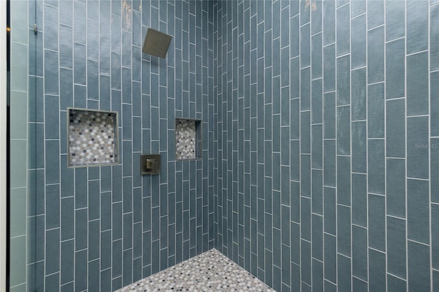 bathroom with tiled shower