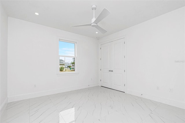 spare room with ceiling fan