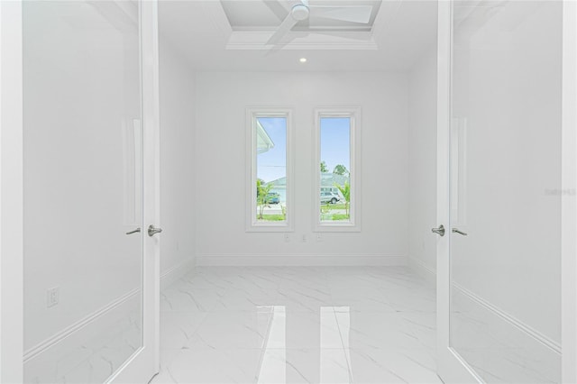 spare room featuring coffered ceiling