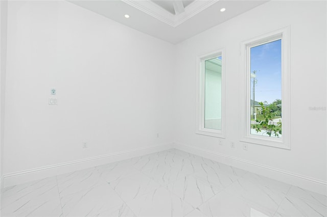 unfurnished room featuring crown molding