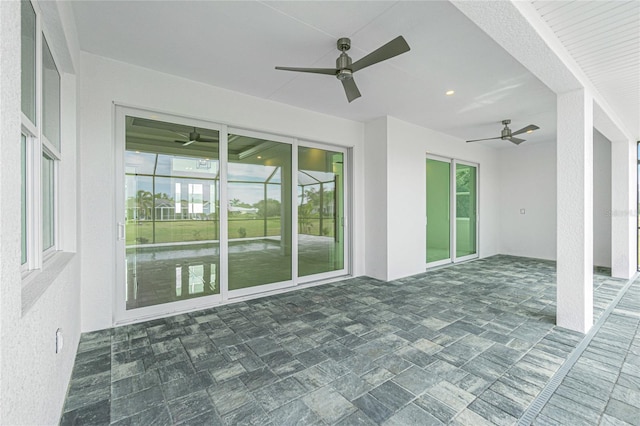 view of patio / terrace featuring ceiling fan