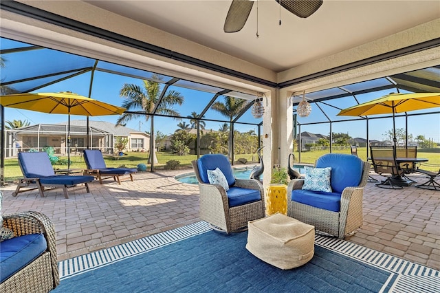 view of patio / terrace with ceiling fan and glass enclosure