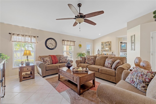 tiled living room featuring ceiling fan and lofted ceiling