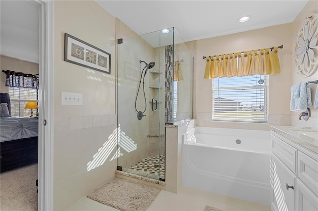 bathroom featuring tile patterned floors, vanity, and separate shower and tub