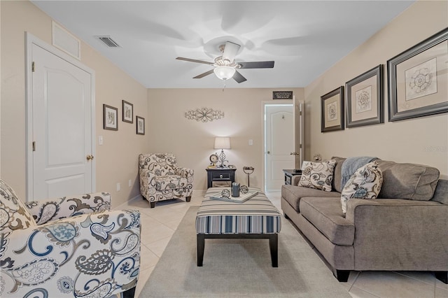 living room with light tile patterned floors and ceiling fan