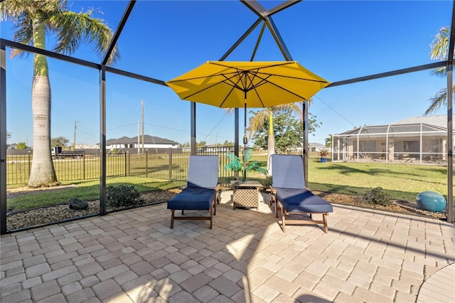 view of patio / terrace featuring a lanai