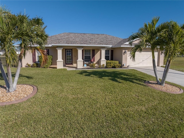 ranch-style house featuring a porch, a garage, and a front lawn