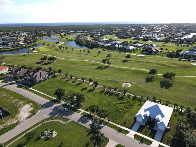 aerial view with a water view and golf course view