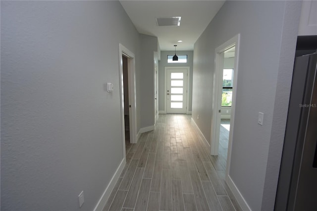 hallway featuring light wood-type flooring