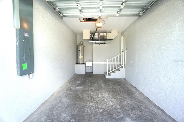 garage with electric panel, gas water heater, sink, and a garage door opener