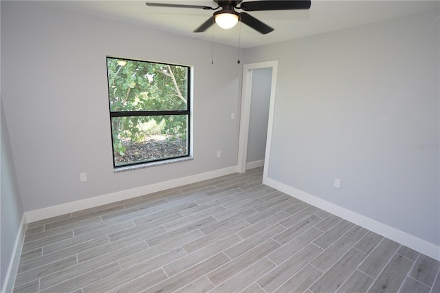 spare room with light hardwood / wood-style floors and ceiling fan