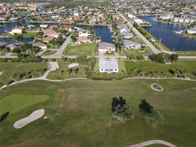 birds eye view of property featuring a residential view, view of golf course, and a water view