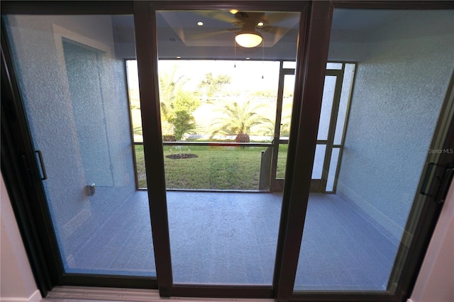 doorway to outside with a textured wall