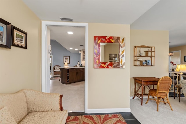 hallway with light carpet