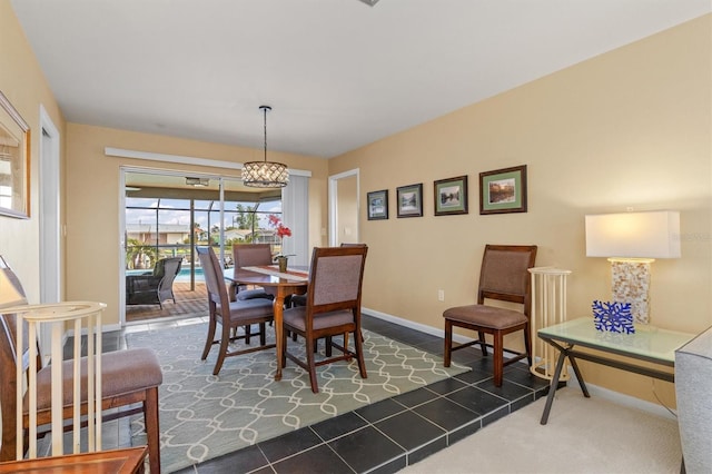 dining area with dark tile patterned floors