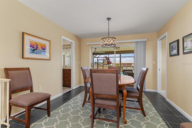 dining area with dark tile patterned floors