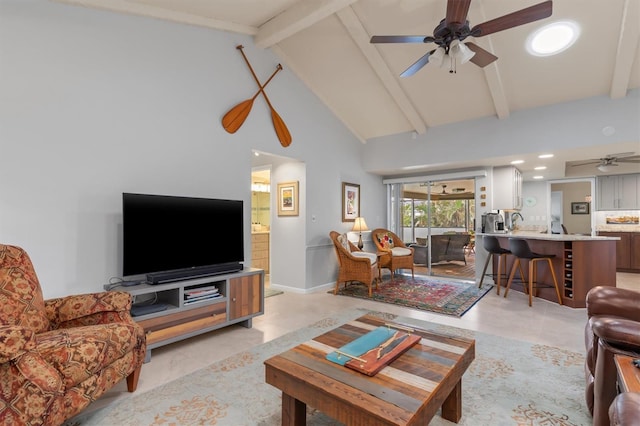 living room with beamed ceiling, ceiling fan, light tile patterned floors, and high vaulted ceiling