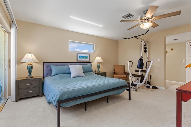 bedroom featuring ceiling fan and light carpet