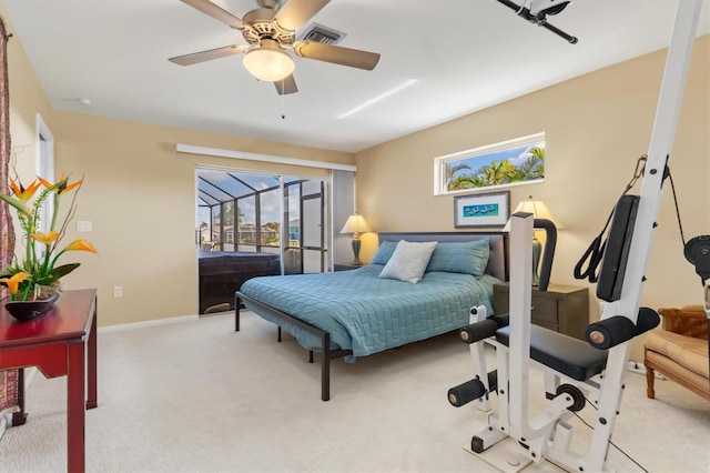 carpeted bedroom with ceiling fan and access to exterior