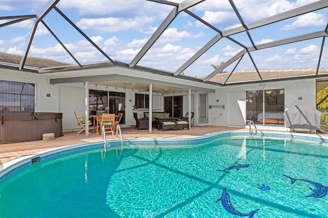 view of pool with ceiling fan, a patio, a hot tub, and glass enclosure