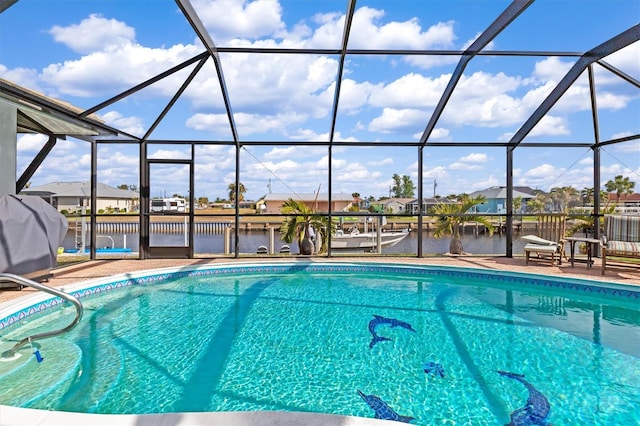 view of pool featuring area for grilling, a lanai, and a water view