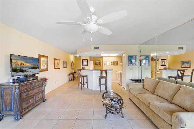 tiled living room featuring ceiling fan