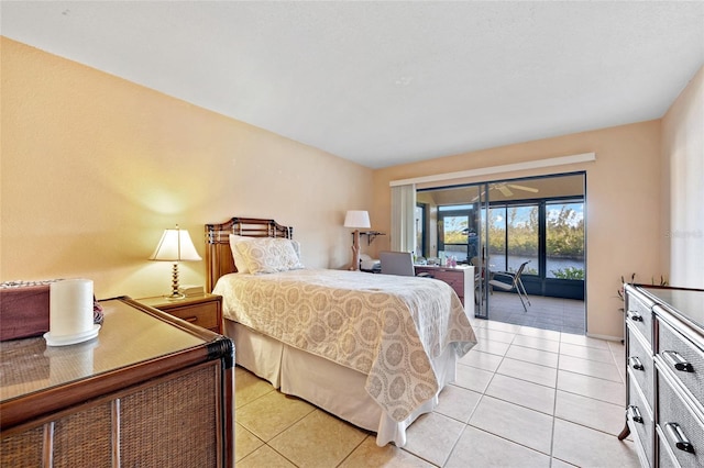 tiled bedroom featuring access to outside