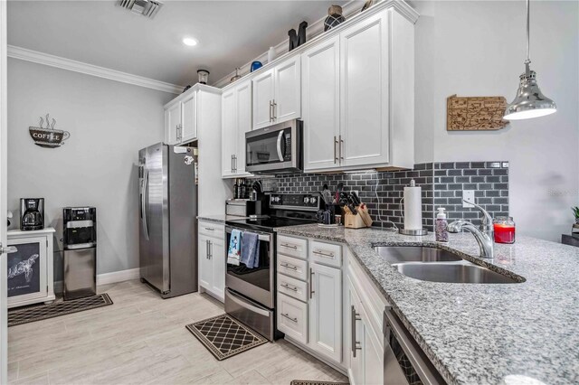 kitchen featuring appliances with stainless steel finishes and white cabinetry