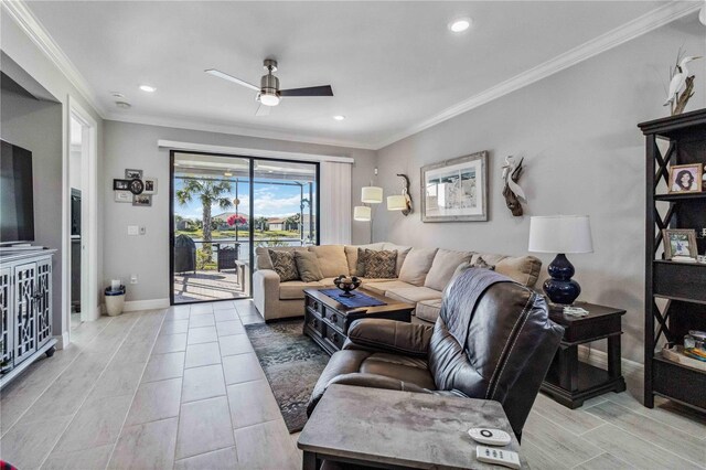 living room featuring ceiling fan, light hardwood / wood-style flooring, and ornamental molding