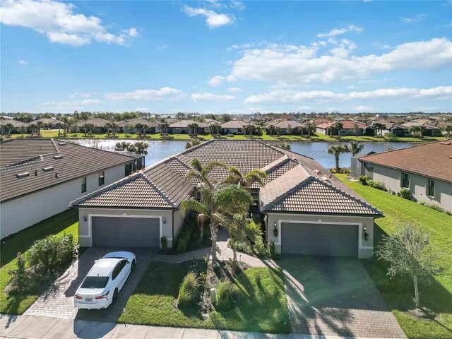 birds eye view of property featuring a water view