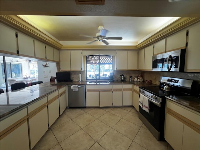 kitchen featuring decorative backsplash, stainless steel appliances, and a healthy amount of sunlight