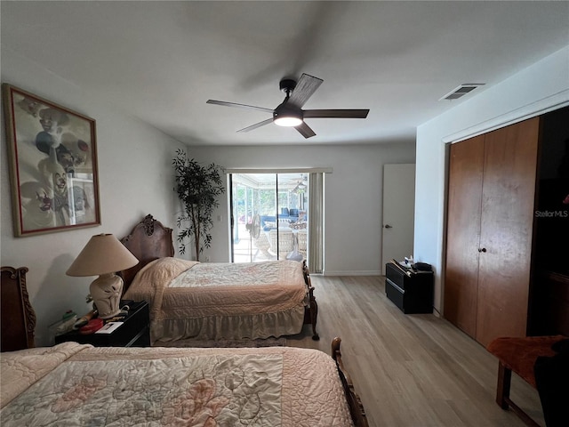 bedroom with access to outside, light hardwood / wood-style floors, and ceiling fan