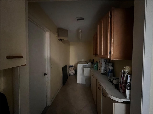 corridor with washer / clothes dryer