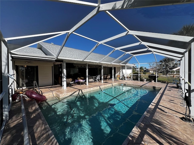 view of pool featuring a patio and a lanai