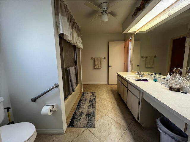 full bathroom featuring ceiling fan, tile patterned floors,  shower combination, toilet, and vanity