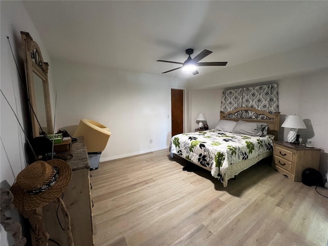 bedroom featuring light hardwood / wood-style flooring and ceiling fan