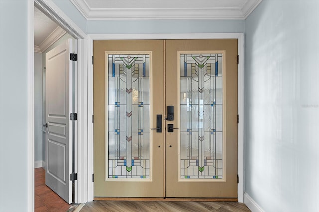 doorway with french doors, hardwood / wood-style flooring, and crown molding