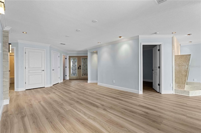 unfurnished living room featuring light hardwood / wood-style floors, crown molding, and a textured ceiling