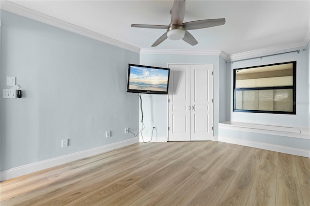 unfurnished bedroom with ceiling fan, a closet, ornamental molding, and light hardwood / wood-style flooring