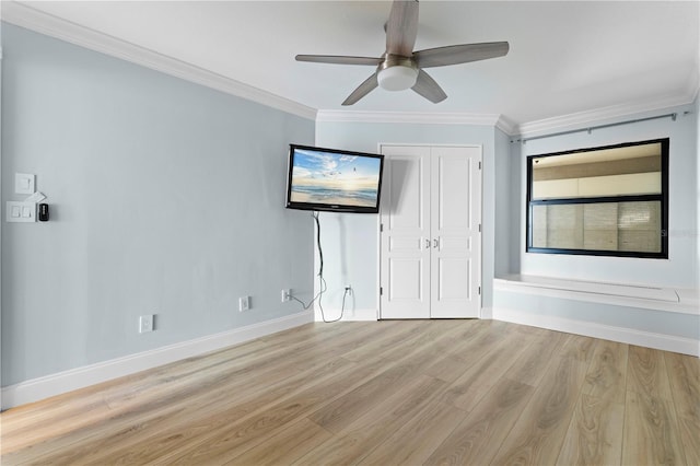 1600 W Marion Ave Unit 234, Punta Gorda, FL 33950 - unfurnished bedroom featuring light wood finished floors, ornamental molding, a closet, and a ceiling fan