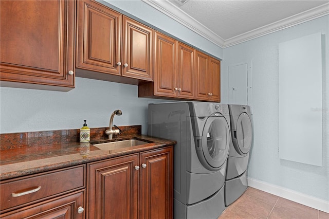 washroom featuring cabinets, crown molding, sink, independent washer and dryer, and a textured ceiling