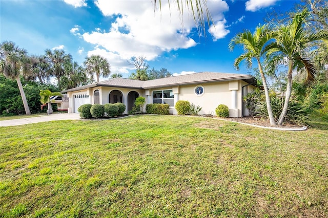 view of front of home featuring a garage and a front lawn