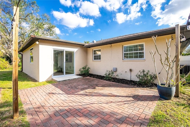 back of property with a patio area